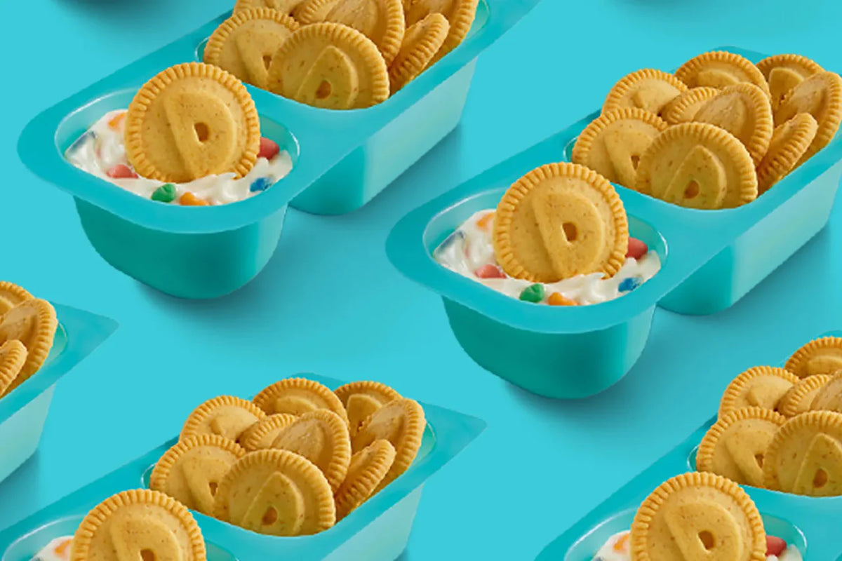 Bowl of ice cream with cookies on a blue background